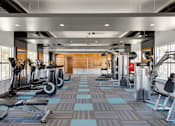 Thumbnail 38 of 54 - A gym with a variety of equipment including treadmills, weights, and exercise machines at Denim Scottsdale, Scottsdale, AZ