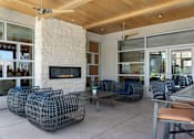 Thumbnail 44 of 54 - A patio with a fireplace and chairs at Denim Scottsdale, Scottsdale, AZ