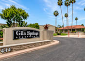 Thumbnail 1 of 20 - The entrance to Gila Springs Apartments is marked by a large sign.
