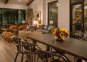 Thumbnail 76 of 76 - a dining room with a wooden table and chairs at Weylyn Luxury Apartments, Arizona