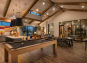 Thumbnail 12 of 76 - a game room with a pool table and a dining area at Weylyn Luxury Apartments, Laveen, Arizona