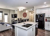 Thumbnail 3 of 24 - Gourmet Kitchen with Custom Cabinetry, Granite Countertop and Pantry at The Premiere at Dana Park, Mesa, 85204