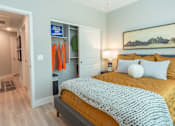 Thumbnail 21 of 52 - North Phoenix, AZ Luxury Apartments With In-Unit Washer And Dryer - The Amelia - Modern Bedroom With Wood-Style Vinyl Plank Flooring, Sliding Closet, And Central Air Conditioning & Heating.
