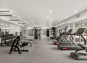 Thumbnail 11 of 26 - Fully equipped fitness center with cardio equipment at Lucero Apartments, Arizona