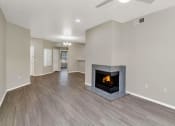 Thumbnail 11 of 37 - an empty living room with a fireplace in it