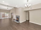 Thumbnail 20 of 37 - the living room has a fireplace and hardwood floors