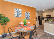 Thumbnail 15 of 36 - A dining room with a table set for a meal at Montage at Pecos Ranch Apartments, Arizona