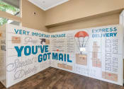 Thumbnail 32 of 36 - A wall with a mail related theme and the words  at Montage at Pecos Ranch Apartments, Chandler