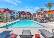 Thumbnail 2 of 76 - our apartments have a swimming pool with lounge chairs and umbrellasat Weylyn Luxury Apartments, Arizona