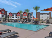 Thumbnail 4 of 76 - our apartments have a swimming pool with chairs and umbrellasat Weylyn Luxury Apartments, Laveen, AZ