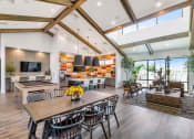 Thumbnail 17 of 76 - a living room with a dining room table and a kitchenat Weylyn Luxury Apartments, Laveen, AZ 85339