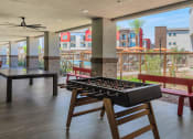 Thumbnail 21 of 76 - a foosball table in the lobby of a building at Weylyn Luxury Apartments, Arizona