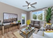 Thumbnail 33 of 76 - a living room with a couch and a ceiling fanat Weylyn Luxury Apartments, Arizona