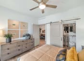 Thumbnail 35 of 76 - a bedroom with a ceiling fan and a closetat Weylyn Luxury Apartments, Laveen, AZ