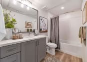 Thumbnail 36 of 76 - a bathroom with a shower and a sink and a toilet at Weylyn Luxury Apartments, Arizona