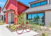 Thumbnail 66 of 76 - a red bike parked in front of a buildingat Weylyn Luxury Apartments, Laveen Arizona