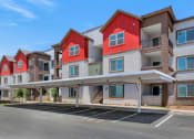 Thumbnail 68 of 76 - an empty parking lot in front of a row of apartment buildings at Weylyn Luxury Apartments, Arizona