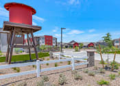 Thumbnail 72 of 76 - a red water tower sits in the middle of a parking lot at Weylyn Luxury Apartments, Arizona