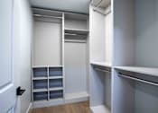 Thumbnail 15 of 51 - A white closet with shelves and drawers at The Laurel Apartments, Chandler, AZ  .