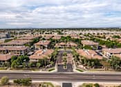 Thumbnail 50 of 51 - A suburban neighborhood with houses and palm trees. at The Laurel Apartments, Chandler  