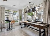 Thumbnail 16 of 40 - A dining room with a wooden table and chairs. at Lazo Apartment Homes, Chandler, AZ 85225  