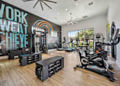 Thumbnail 4 of 40 - A gym with a variety of equipment including treadmills, weights, and a rowing machine. at Lazo Apartment Homes, Chandler Arizona  