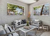 Thumbnail 12 of 40 - A modern outdoor patio with a glass table and grey couches. at Lazo Apartment Homes, Arizona  