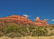 Thumbnail 1 of 14 - Red rock mountain landscape with desert vegetation at Pinon Lofts Apartments, Sedona, AZ