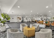 Thumbnail 26 of 26 - Spacious clubhouse lobby with modern seating areas at Lucero Apartments, Arizona, 85051