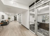 Thumbnail 25 of 26 - Professional office space with glass entry doors at Lucero Apartments, Phoenix, AZ 85051