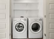 Thumbnail 23 of 26 - In unit washer and dryer in laundry closet at Lucero Apartments, Arizona