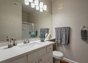 Thumbnail 22 of 42 - A bathroom with a white counter top and a white toilet.at Palazzo Townhomes, Arizona, 85008