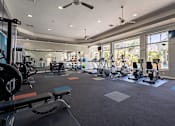 Thumbnail 33 of 42 - A spacious gym with a variety of exercise equipment.at Palazzo Townhomes, Arizona  