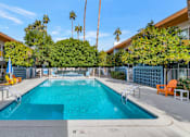 Thumbnail 21 of 26 - A rectangular pool with a diving board in the middle at The Phoenix Apartments on 6th Avenue, Arizona