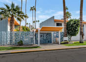 Thumbnail 22 of 26 - A building with a blue and white facade is surrounded by palm trees at The Phoenix Apartments on 6th Avenue, Arizona 85013