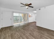 Thumbnail 7 of 26 - A room with a ceiling fan and wooden Floor at The Phoenix Apartments on 6th Avenue, Phoenix 85013