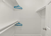 Thumbnail 10 of 36 - Two blue hangers are on the white wall at Urban WalkApartments on 6th Avenue, Arizona