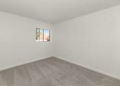 Thumbnail 17 of 36 - A room with a carpeted floor at Urban WalkApartments on 6th Avenue, Phoenix