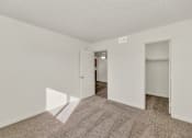 Thumbnail 18 of 36 - A room with a carpeted floor and white walls at Urban WalkApartments on 6th Avenue, Phoenix, AZ