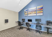 Thumbnail 29 of 36 - A room with a blue wall and a painting on it at Urban WalkApartments on 6th Avenue, Phoenix