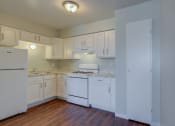 Thumbnail 1 of 21 - Kitchen With White Cabinetry And Appliances at Johnson Legacy Apartments, Milwaukee, WI, 53223