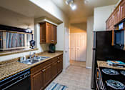 Thumbnail 15 of 27 - Gourmet Kitchen with Appliances at Apartments for Rent in North Las Vegas NV