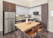 Thumbnail 11 of 23 - The Arbory Apartment Kitchen with Stainless Steel Appliances