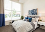 Thumbnail 14 of 23 - The Arbory Apartment Bedroom with Large Windows
