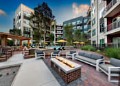 Thumbnail 26 of 26 - Outdoor Lounge Area with Fire Pit in Atlanta Apartments Near Suntrust Park