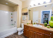 Thumbnail 19 of 27 - a bathroom with a sink toilet and a bath tub