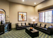 Thumbnail 11 of 27 - a living room with couches and a coffee table