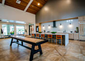 Thumbnail 16 of 19 - Large Clubhouse with Shuffleboard at New Apartments Ridgefield WA