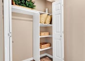 Thumbnail 17 of 22 - Apartment Closet with Shelves in Albuquerque and White Doors