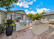 Thumbnail 19 of 22 - Outdoor Barbeques on Tile Deck in New Mexico Apartment Complex
